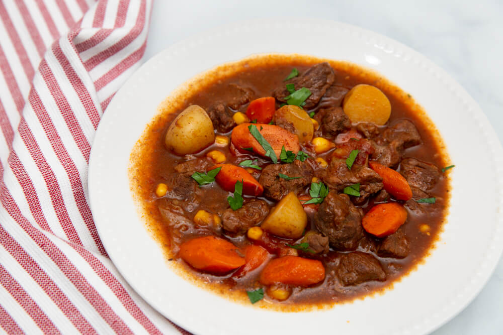 beef stew in a white bowl horizontal