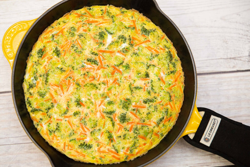 veggie frittata in a yellow skillet