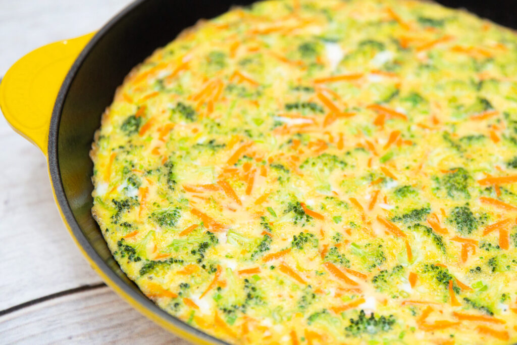 veggie frittata in a yellow skillet