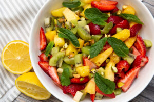 tropical fruit salad in a white bowl