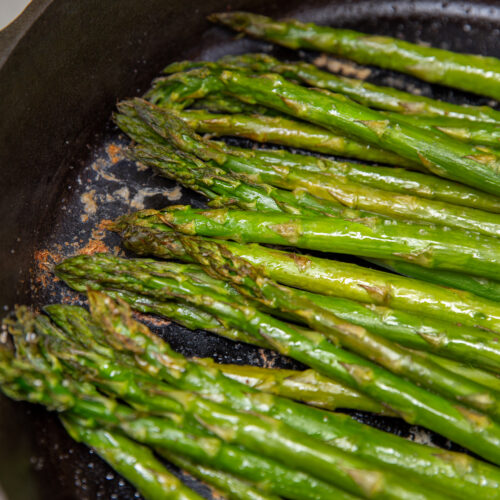 roasted asparagus in a cast iron skillet