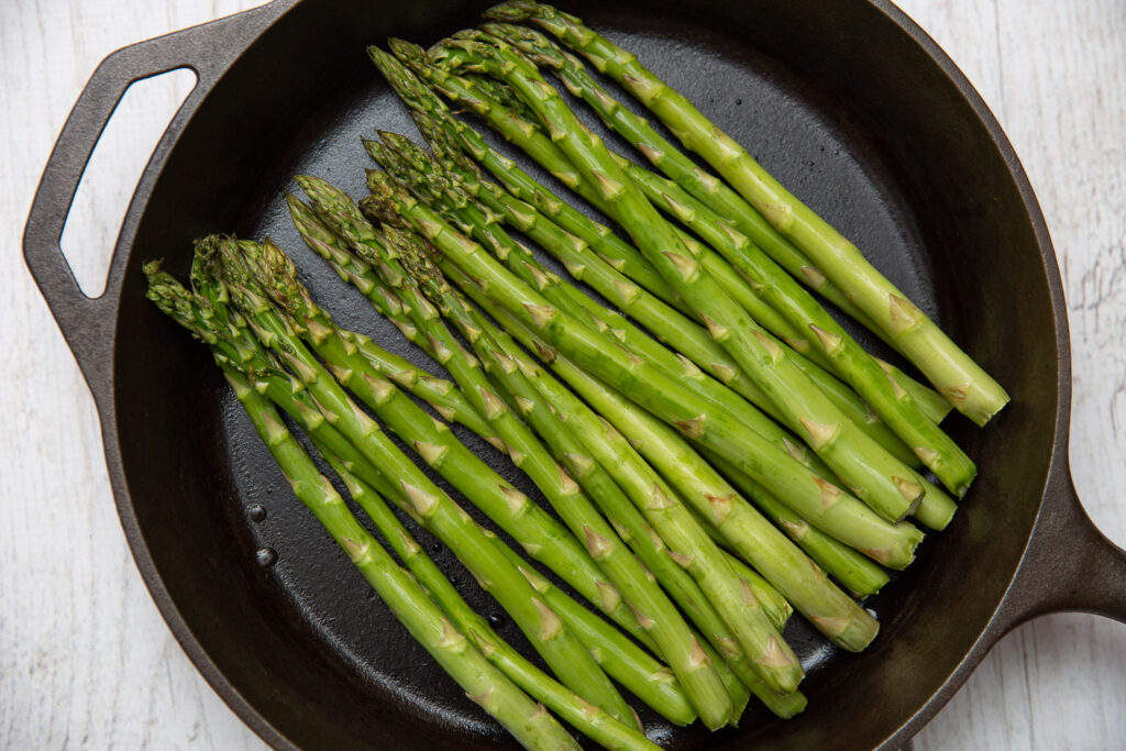 asparagus in a cast iron skillet