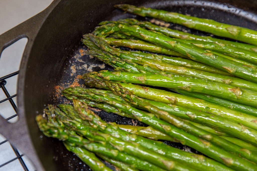 roasted asparagus in a cast iron skillet