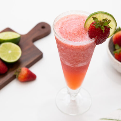 frozen strawberry margarita in a tall glass