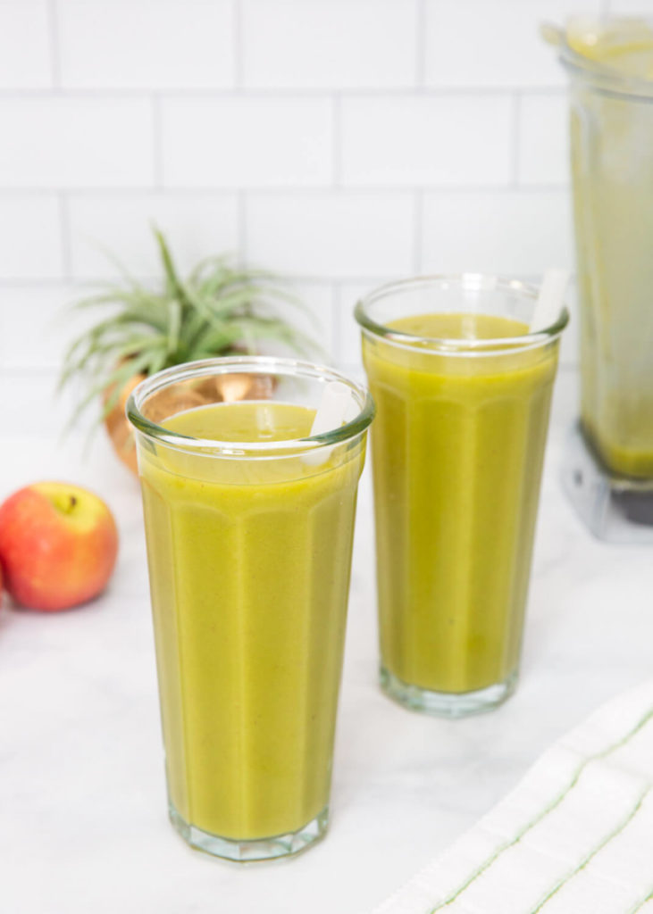 two green smoothies in tall glasses