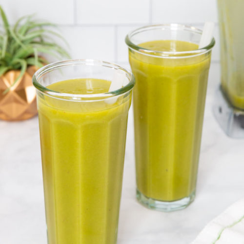 two green smoothies in tall glasses