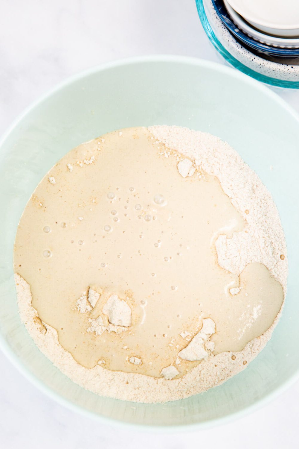 mixing dry and wet ingredients for applesauce donut bites