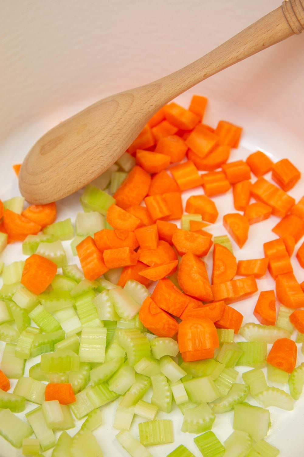 diced carrots and celery in a dutch oven