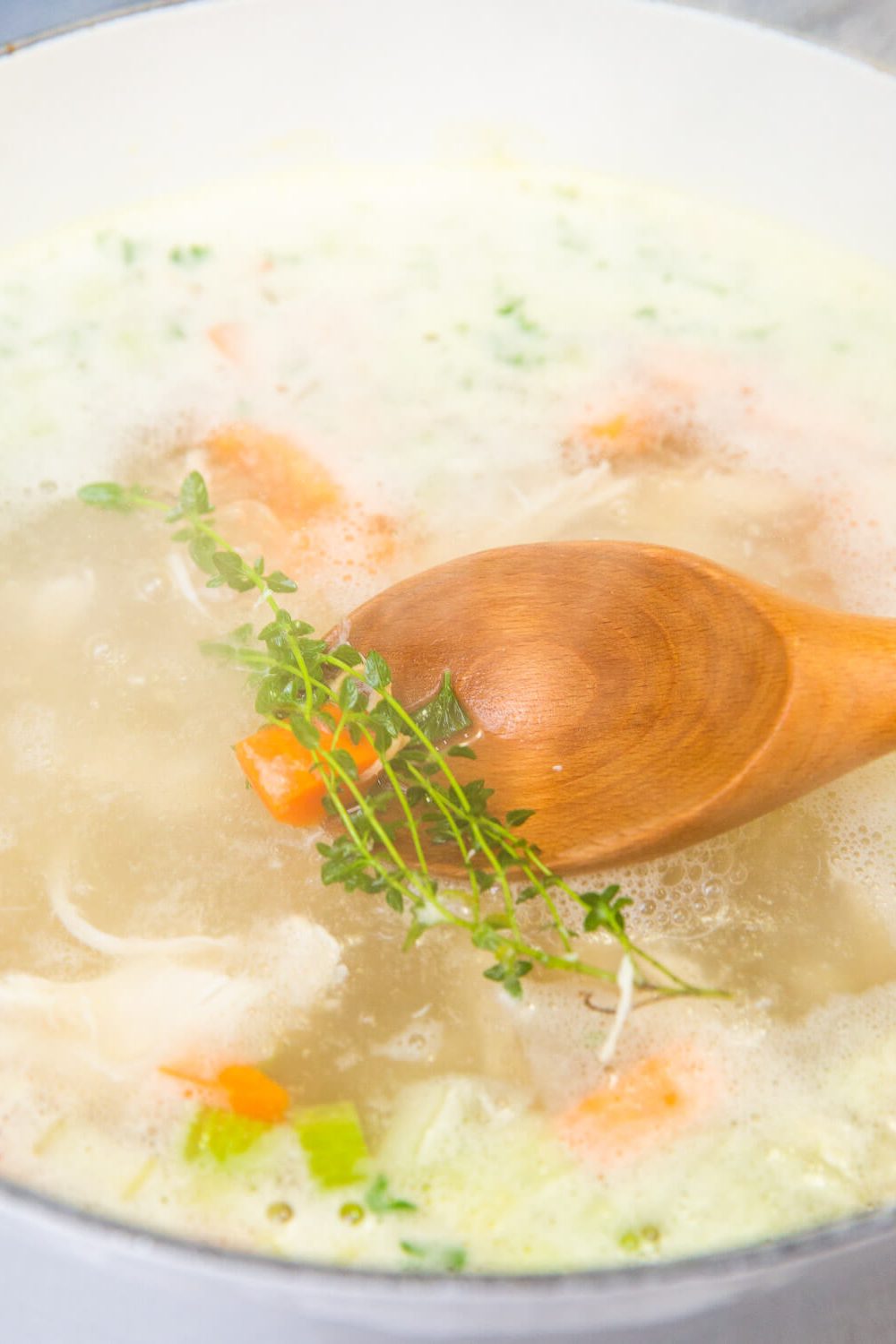 chicken noodle soup in a white bowl