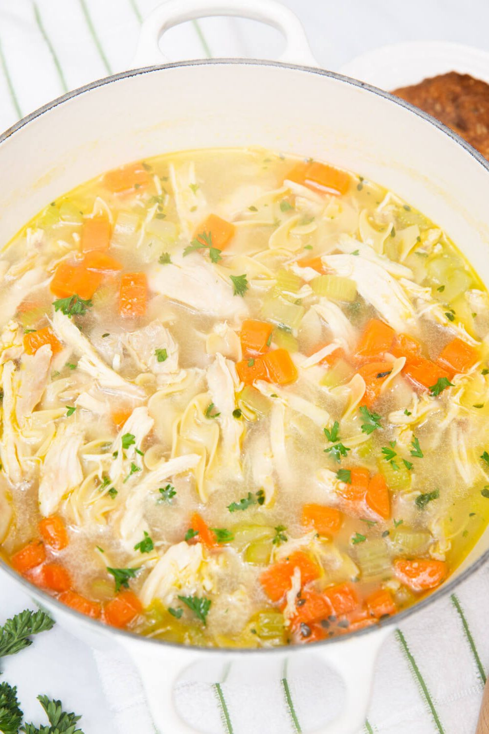 chicken noodle soup in a white bowl